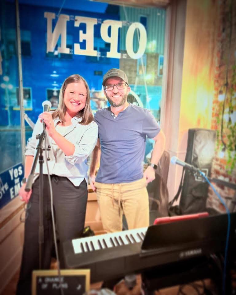 A Change Of Plans performing together at a downtown venue.